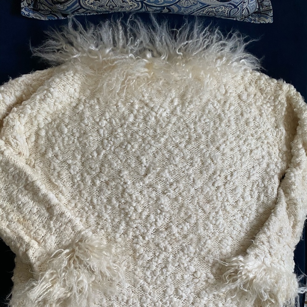 Custom knitted sweater with fur cuffs and collar
